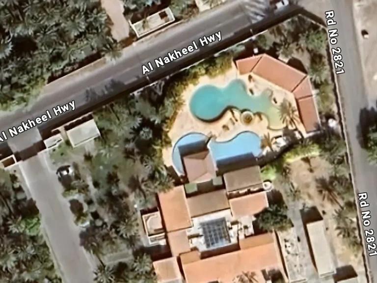Google Maps satellite view of a custom-designed zero-edge pool and private villa complex in Bahrain, showing full site integration