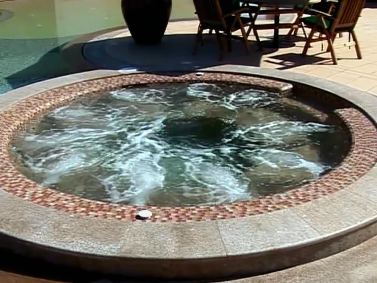 Circular mosaic spa integrated into the pool terrace of a luxury residential project in Bahrain