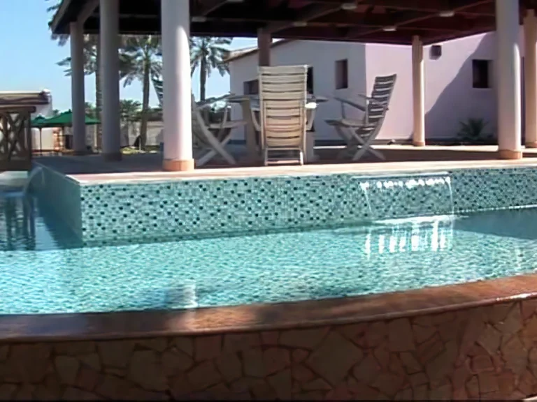 Mosaic-tiled overflow pool designed for children, integrated into a luxury residential project in Bahrain