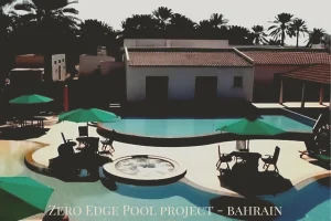 Bird’s-eye view of the custom-designed zero-edge pool complex in Bahrain, showing infinity pool, spa,